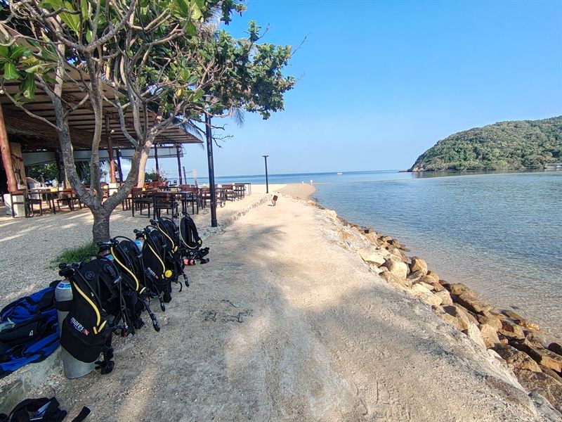 Dive equipment lined up on the beach at Koh Ma.